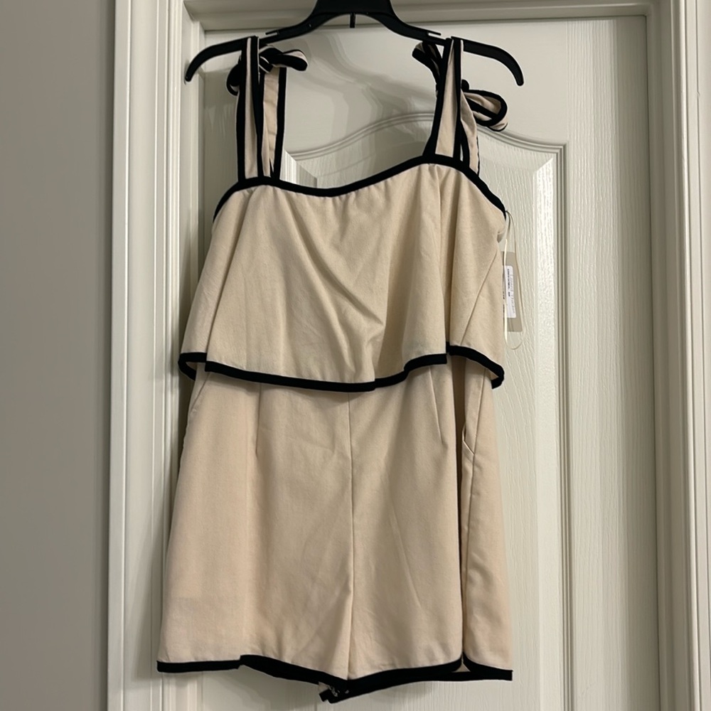 Boutique Cream and Black romper with bow ties